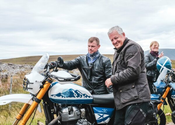 Two motorcyclists enjoying a scenic ride through the beautiful landscapes of Scotland